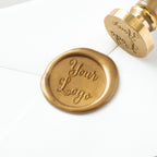 Gold wax seal stamp with 'Your Logo' text on a white background