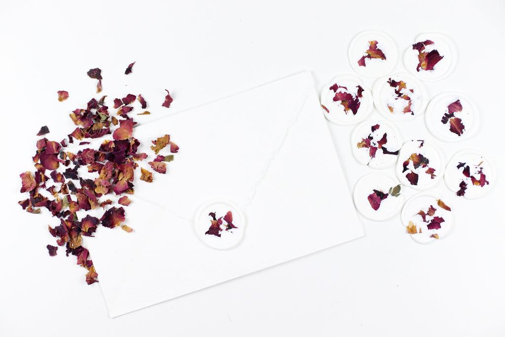 Red Rose Petals on White Wax