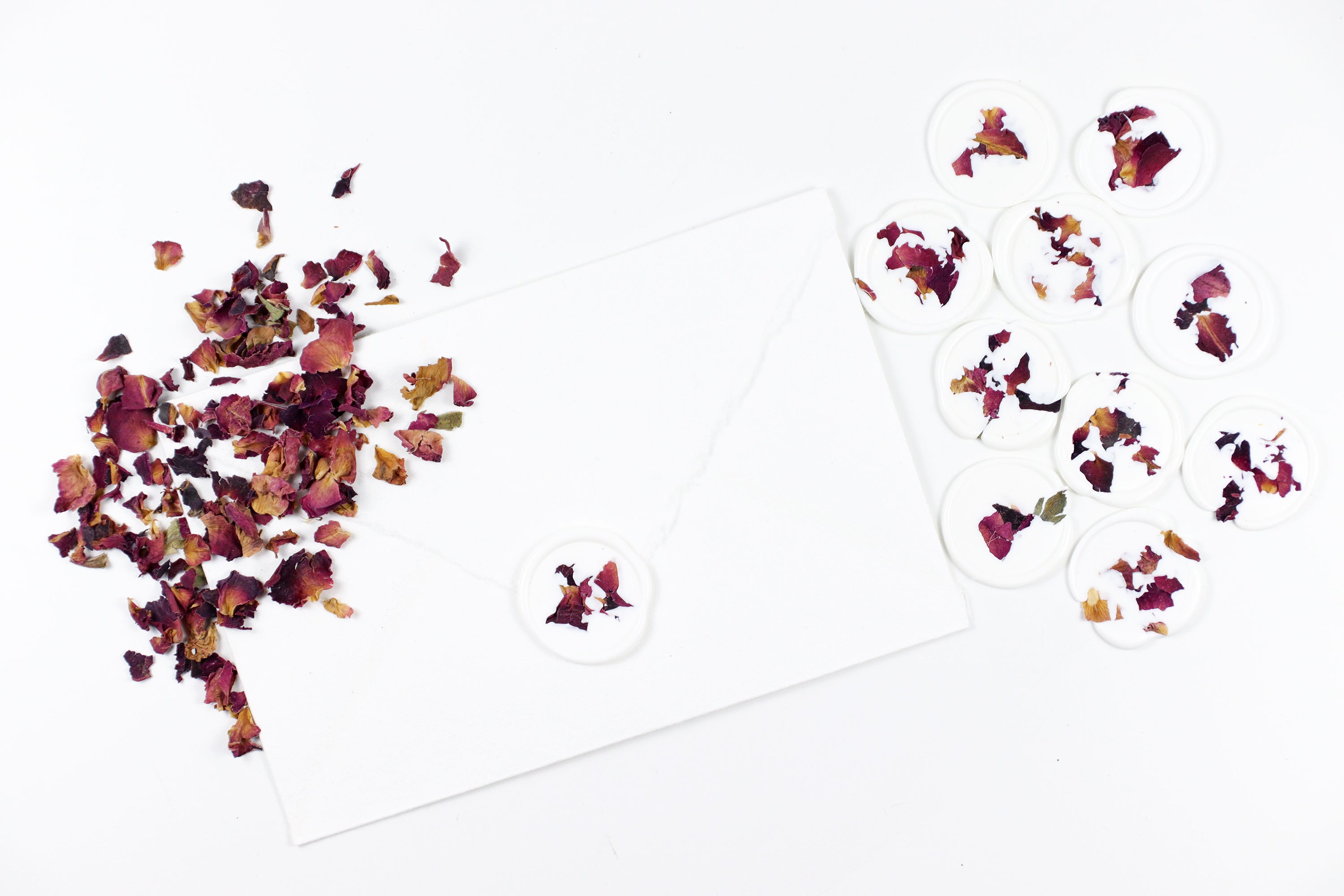 Red Rose Petals on White Wax