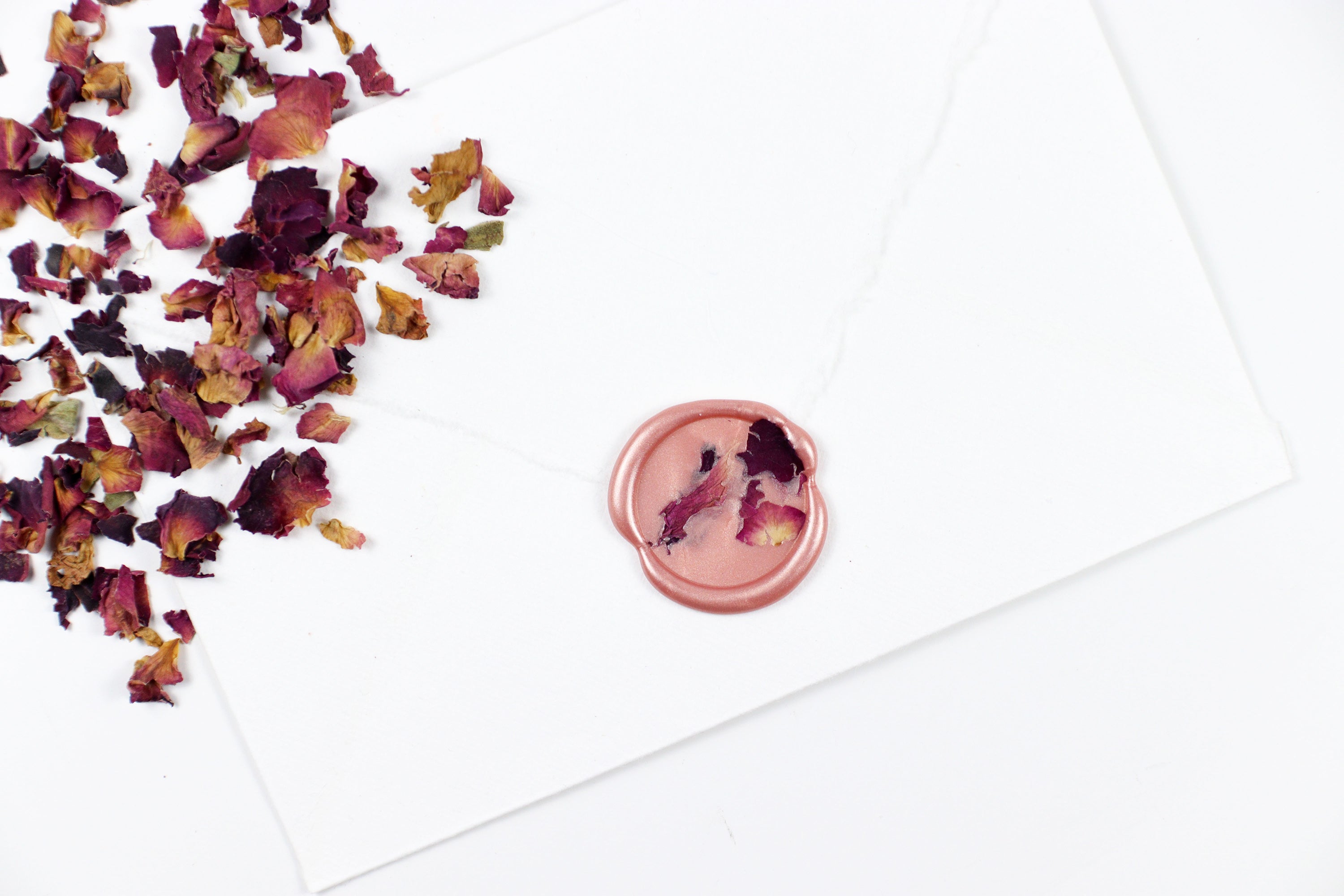Red Rose Petals on Rose Gold Wax