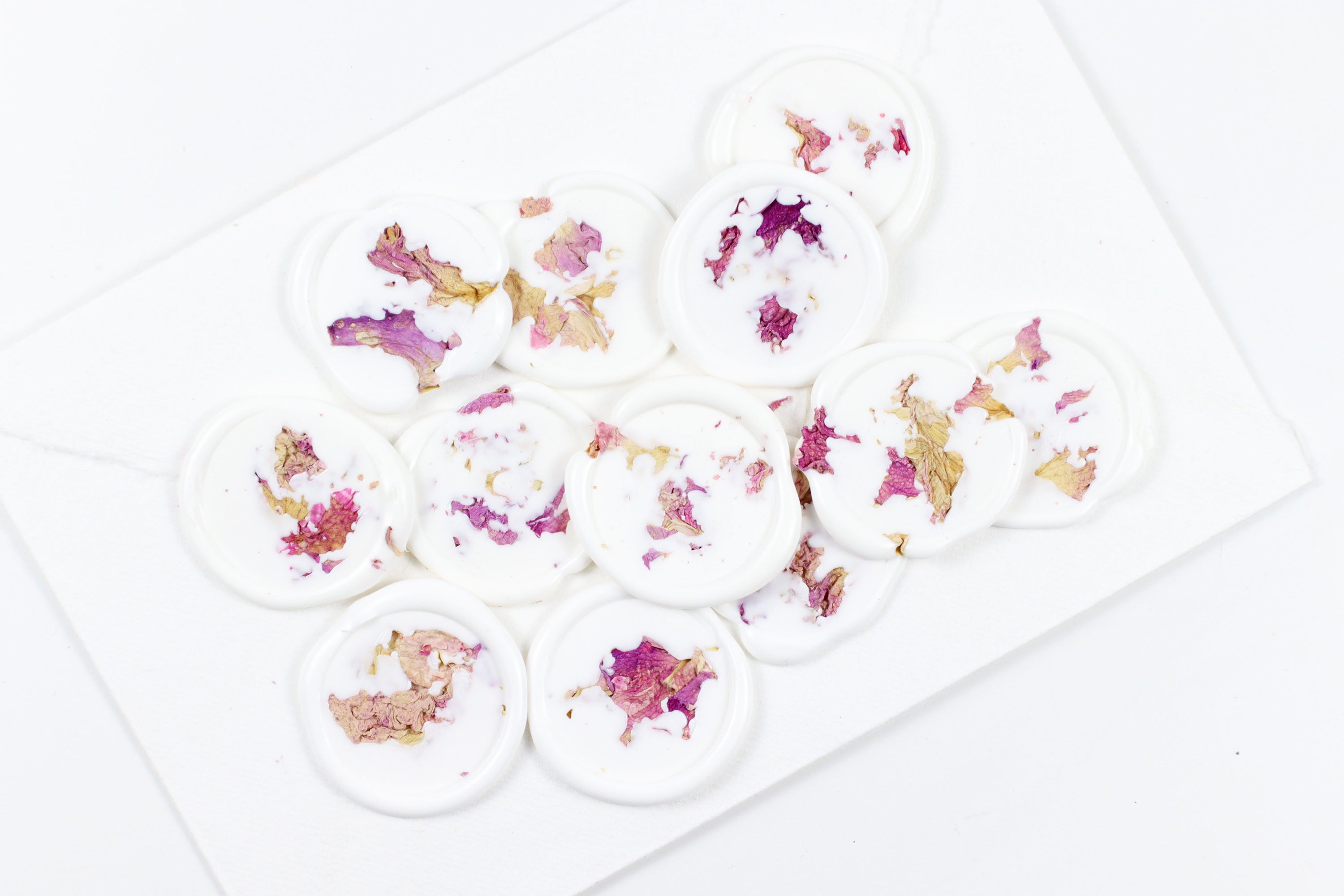 Pink Rose Petals on White Wax
