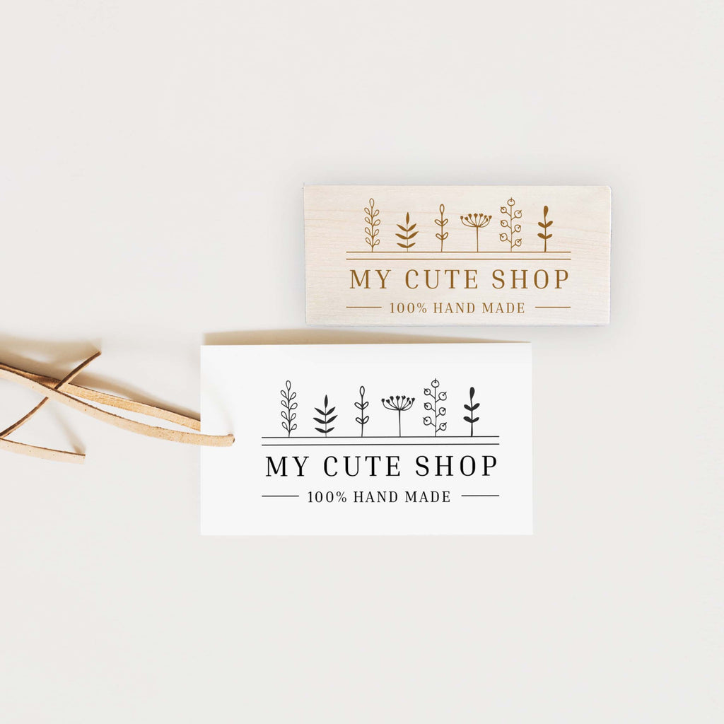 Two wooden handle stamps with the text 'MY CUTE SHOP' and '100% HAND MADE' engraved on them, one on a beige background and the other on a white background.