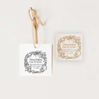 A personalized Christmas address stamp with a wreath design, available in wood handle and self-inking square options.